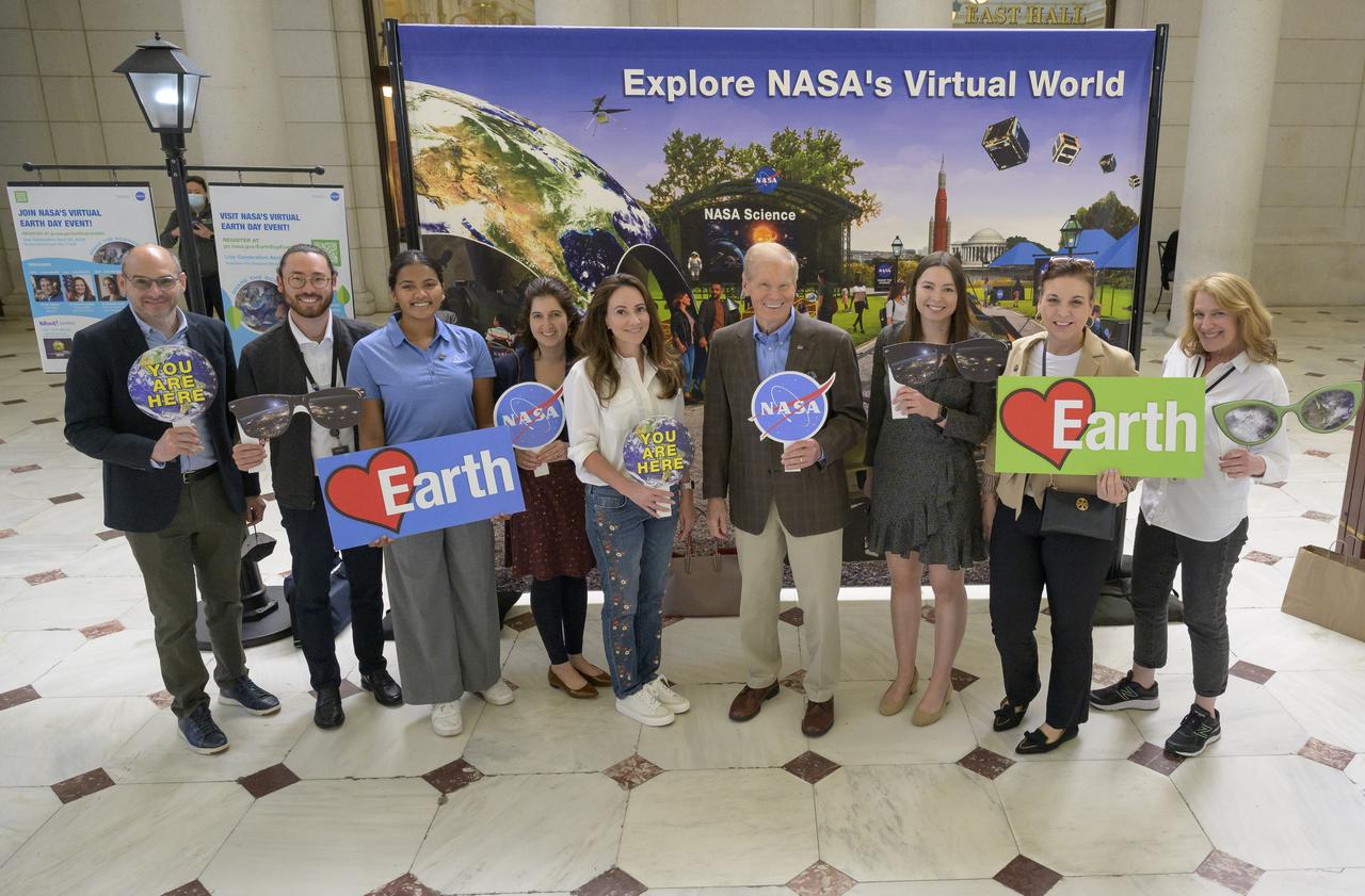 NASA Administrator Bill Nelson, center, joins with other NASA colleagues in recognizing Earth Day at one of many NASA exhibits at Union Station in Washington, Friday, April 22, 2022. Photo Credit: (NASA/Bill Ingalls)