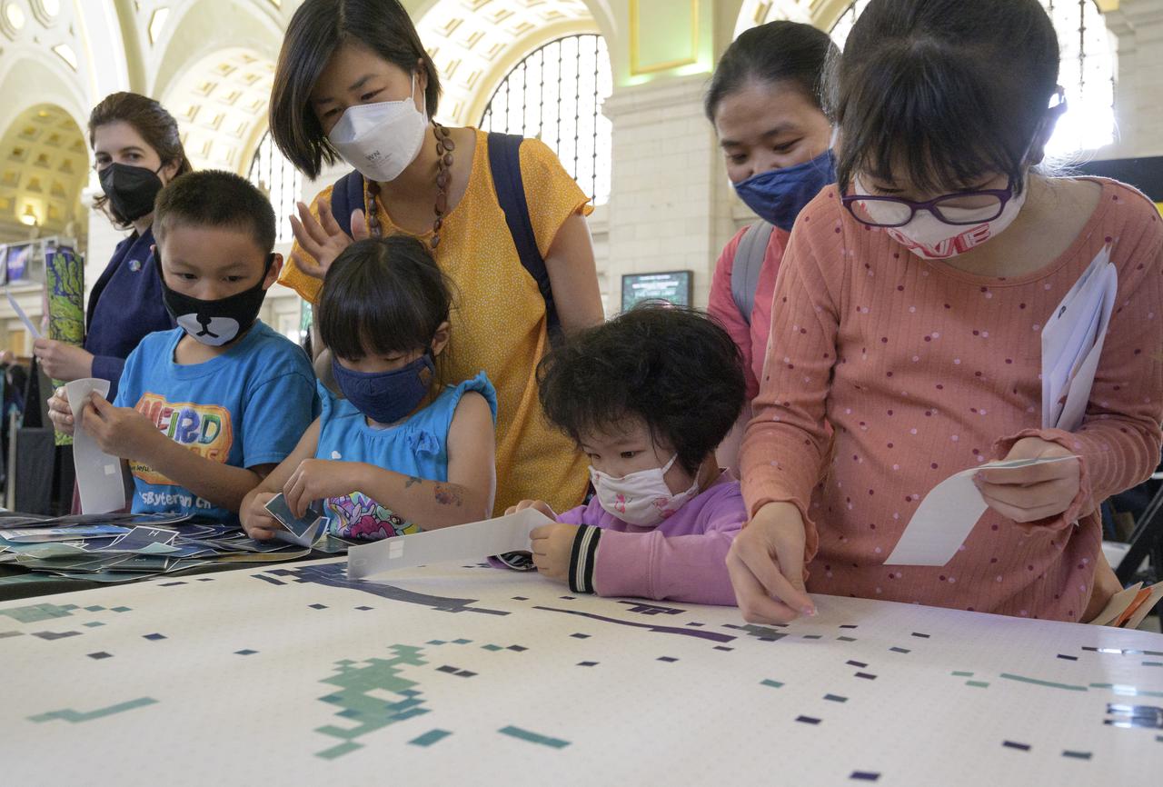 Visitors explore NASA’s hands-on exhibits during Earth Day, Friday, April 22, 2022, at Union Station in Washington. Photo Credit: (NASA/Bill Ingalls)
