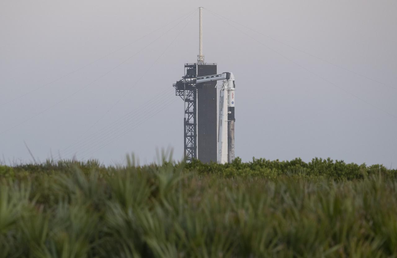 A SpaceX Falcon 9 rocket with the company's Crew Dragon spacecraft onboard is seen on the launch pad at Launch Complex 39A as preparations continue for the Crew-4 mission, Monday, April 25, 2022, at NASA’s Kennedy Space Center in Florida. NASA’s SpaceX Crew-4 mission is the fourth crew rotation mission of the SpaceX Crew Dragon spacecraft and Falcon 9 rocket to the International Space Station as part of the agency’s Commercial Crew Program. NASA astronauts Kjell Lindgren, Robert Hines, Jessica Watkins, and ESA (European Space Agency) astronaut Samantha Cristoforetti are scheduled to launch no earlier than April 27 from Launch Complex 39A at the Kennedy Space Center. Photo Credit: (NASA/Joel Kowsky)