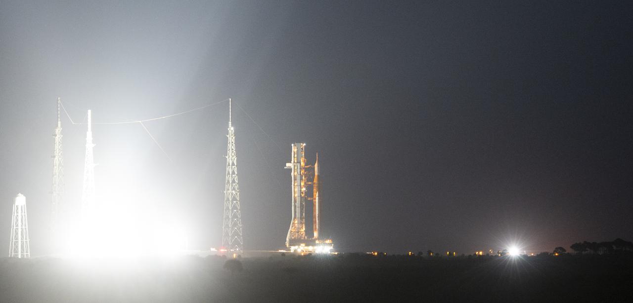 NASA’s Space Launch System (SLS) rocket with the Orion spacecraft aboard is seen atop a mobile launcher as it rolls back to the Vehicle Assembly Building, Monday, April 25, 2022, at NASA’s Kennedy Space Center in Florida. Once inside the Vehicle Assembly Building, teams will work on replacing a faulty upper stage check valve and a small leak within the tail service mast umbilical ground plate housing on the mobile launcher while the supplier for the gaseous nitrogen makes upgrades to their pipeline configuration to support Artemis I testing and launch. Following completion, teams will return to the launch pad to complete the next wet dress rehearsal attempt. Photo Credit: (NASA/Joel Kowsky)