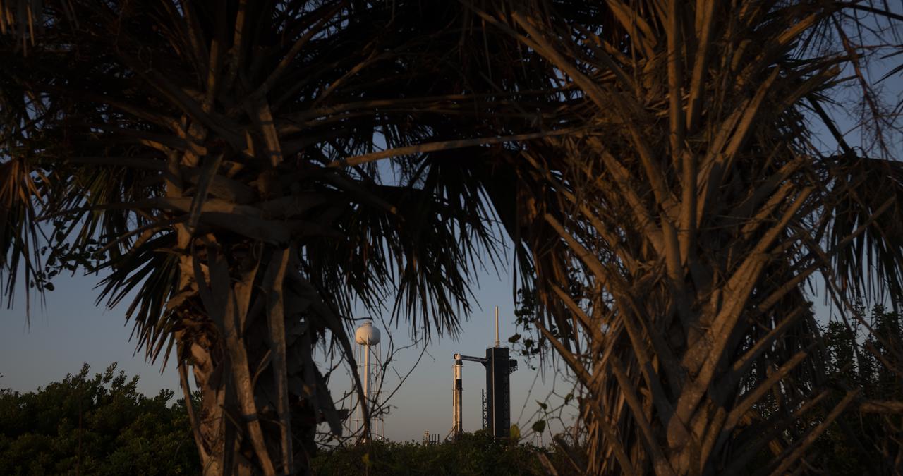 A SpaceX Falcon 9 rocket with the company's Crew Dragon spacecraft onboard is seen at sunrise on the launch pad at Launch Complex 39A as preparations continue for the Crew-4 mission, Tuesday, April 26, 2022, at NASA’s Kennedy Space Center in Florida. NASA’s SpaceX Crew-4 mission is the fourth crew rotation mission of the SpaceX Crew Dragon spacecraft and Falcon 9 rocket to the International Space Station as part of the agency’s Commercial Crew Program. NASA astronauts Kjell Lindgren, Robert Hines, Jessica Watkins, and ESA (European Space Agency) astronaut Samantha Cristoforetti are scheduled to launch on no earlier than April 27, from Launch Complex 39A at the Kennedy Space Center. Photo Credit: (NASA/Joel Kowsky)