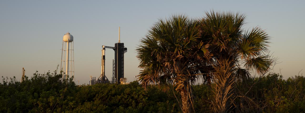 A SpaceX Falcon 9 rocket with the company's Crew Dragon spacecraft onboard is seen at sunrise on the launch pad at Launch Complex 39A as preparations continue for the Crew-4 mission, Tuesday, April 26, 2022, at NASA’s Kennedy Space Center in Florida. NASA’s SpaceX Crew-4 mission is the fourth crew rotation mission of the SpaceX Crew Dragon spacecraft and Falcon 9 rocket to the International Space Station as part of the agency’s Commercial Crew Program. NASA astronauts Kjell Lindgren, Robert Hines, Jessica Watkins, and ESA (European Space Agency) astronaut Samantha Cristoforetti are scheduled to launch on no earlier than April 27, from Launch Complex 39A at the Kennedy Space Center. Photo Credit: (NASA/Joel Kowsky)