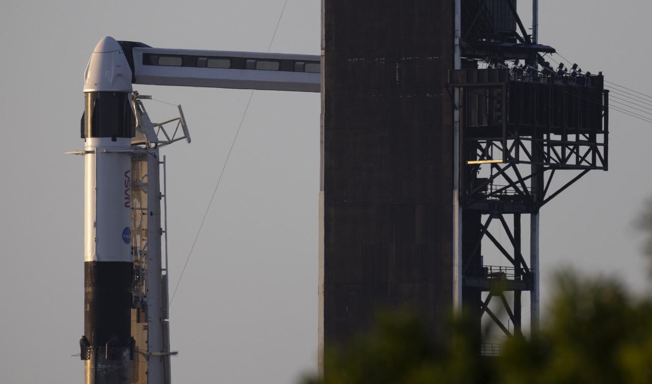 A SpaceX Falcon 9 rocket with the company's Crew Dragon spacecraft onboard is seen at sunrise on the launch pad at Launch Complex 39A as preparations continue for the Crew-4 mission, Tuesday, April 26, 2022, at NASA’s Kennedy Space Center in Florida. NASA’s SpaceX Crew-4 mission is the fourth crew rotation mission of the SpaceX Crew Dragon spacecraft and Falcon 9 rocket to the International Space Station as part of the agency’s Commercial Crew Program. NASA astronauts Kjell Lindgren, Robert Hines, Jessica Watkins, and ESA (European Space Agency) astronaut Samantha Cristoforetti are scheduled to launch on no earlier than April 27, from Launch Complex 39A at the Kennedy Space Center. Photo Credit: (NASA/Joel Kowsky)