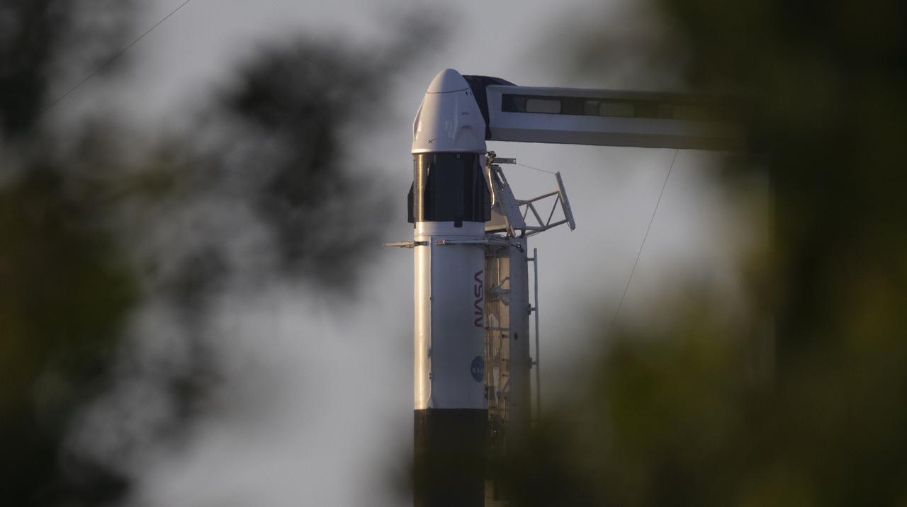 A SpaceX Falcon 9 rocket with the company's Crew Dragon spacecraft onboard is seen at sunrise on the launch pad at Launch Complex 39A as preparations continue for the Crew-4 mission, Tuesday, April 26, 2022, at NASA’s Kennedy Space Center in Florida. NASA’s SpaceX Crew-4 mission is the fourth crew rotation mission of the SpaceX Crew Dragon spacecraft and Falcon 9 rocket to the International Space Station as part of the agency’s Commercial Crew Program. NASA astronauts Kjell Lindgren, Robert Hines, Jessica Watkins, and ESA (European Space Agency) astronaut Samantha Cristoforetti are scheduled to launch on no earlier than April 27, from Launch Complex 39A at the Kennedy Space Center. Photo Credit: (NASA/Joel Kowsky)