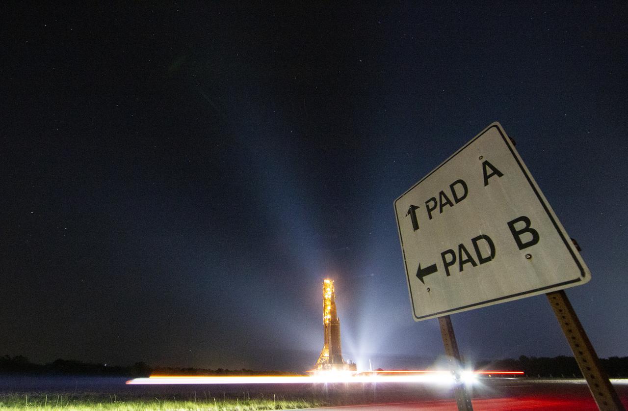 NASA’s Space Launch System (SLS) rocket with the Orion spacecraft aboard is seen atop a mobile launcher as it rolls back to the Vehicle Assembly Building, Tuesday, April 26, 2022, at NASA’s Kennedy Space Center in Florida. Once inside the Vehicle Assembly Building, teams will work on replacing a faulty upper stage check valve and a small leak within the tail service mast umbilical ground plate housing on the mobile launcher while the supplier for the gaseous nitrogen makes upgrades to their pipeline configuration to support Artemis I testing and launch. Following completion, teams will return to the launch pad to complete the next wet dress rehearsal attempt. Photo Credit: (NASA/Aubrey Gemignani)