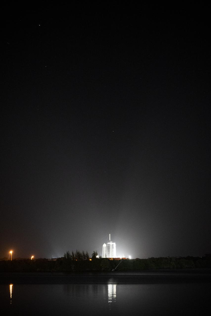 A SpaceX Falcon 9 rocket with the company's Crew Dragon spacecraft onboard is seen illuminated by spotlights on the launch pad at Launch Complex 39A as preparations continue for the Crew-4 mission, Tuesday, April 26, 2022, at NASA’s Kennedy Space Center in Florida. NASA’s SpaceX Crew-4 mission is the fourth crew rotation mission of the SpaceX Crew Dragon spacecraft and Falcon 9 rocket to the International Space Station as part of the agency’s Commercial Crew Program. NASA astronauts Kjell Lindgren, Robert Hines, Jessica Watkins, and ESA (European Space Agency) astronaut Samantha Cristoforetti are scheduled to launch on 3:52 a.m. ET on April 27 from Launch Complex 39A at the Kennedy Space Center. Photo Credit: (NASA/Joel Kowsky)