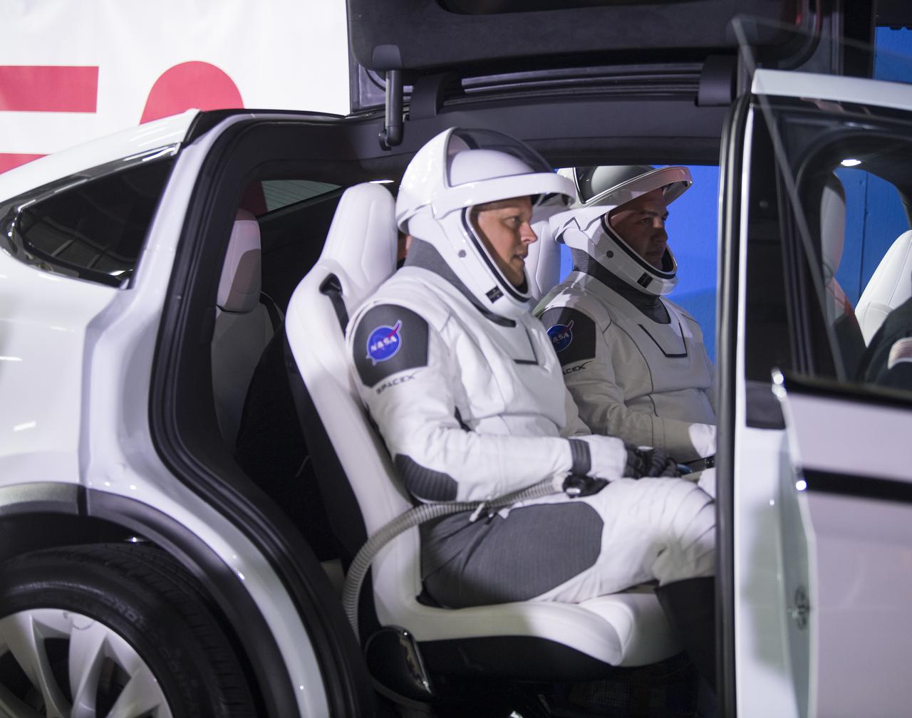 NASA astronauts Robert Hines, left, and Kjell Lindgren, right, are seen in the vehicle that will carry them and crew mates NASA astronaut Jessica Watkins, and ESA (European Space Agency) astronaut Samantha Cristoforetti, to Launch Complex 39A to board the SpaceX Crew Dragon spacecraft for the Crew-4 mission launch, Tuesday, April 26, 2022, at NASA’s Kennedy Space Center in Florida. NASA’s SpaceX Crew-4 mission is the fourth crew rotation mission of the SpaceX Crew Dragon spacecraft and Falcon 9 rocket to the International Space Station as part of the agency’s Commercial Crew Program. Lindgren, Hines, Watkins, and Cristoforetti are scheduled to launch at 3:52 a.m. ET on April 27, from Launch Complex 39A at the Kennedy Space Center.  Photo Credit: (NASA/Aubrey Gemignani)