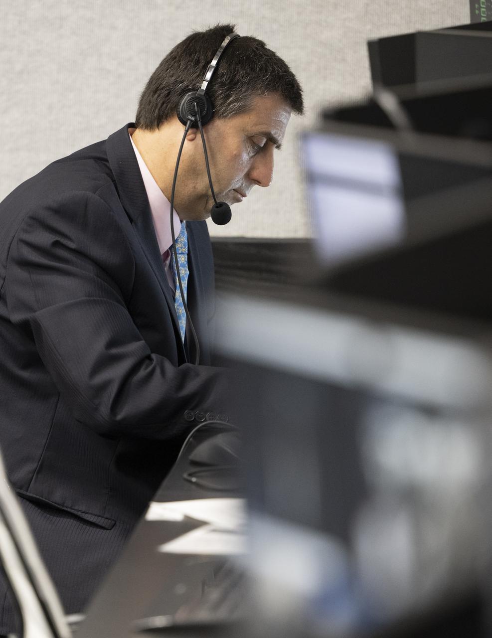 NASA International Space Station program manger Joel Montalbano, monitors the countdown of the launch of a SpaceX Falcon 9 rocket carrying the company's Crew Dragon spacecraft on NASA’s SpaceX Crew-4 mission with NASA astronauts Kjell Lindgren, Robert Hines, Jessica Watkins, and ESA (European Space Agency) astronaut Samantha Cristoforetti onboard, Wednesday, April 27, 2022, in firing room four of the Rocco A. Petrone Launch Control Center at NASA’s Kennedy Space Center in Florida. NASA’s SpaceX Crew-4 mission is the fourth crew rotation mission of the SpaceX Crew Dragon spacecraft and Falcon 9 rocket to the International Space Station as part of the agency’s Commercial Crew Program. Lindgren, Hines, Watkins, and Cristoforetti launched at 3:52 a.m. ET, from Launch Complex 39A at the Kennedy Space Center. Photo Credit: (NASA/Joel Kowsky)