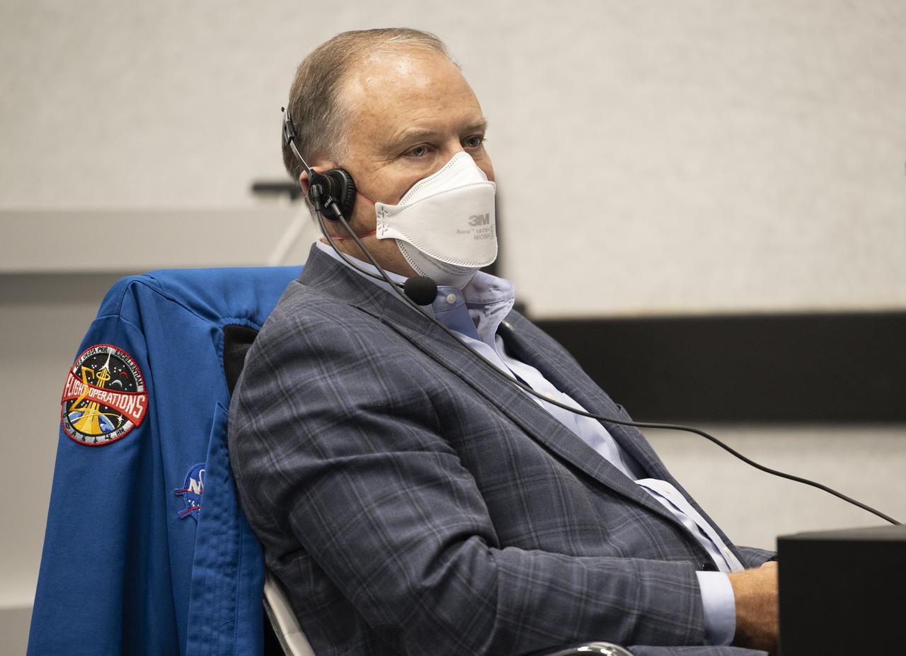 Norm Knight, director of Flight Operations at NASA's Johnson Space Center, monitors the countdown of the launch of a SpaceX Falcon 9 rocket carrying the company's Crew Dragon spacecraft on NASA’s SpaceX Crew-4 mission with NASA astronauts Kjell Lindgren, Robert Hines, Jessica Watkins, and ESA (European Space Agency) astronaut Samantha Cristoforetti onboard, Wednesday, April 27, 2022, in firing room four of the Rocco A. Petrone Launch Control Center at NASA’s Kennedy Space Center in Florida. NASA’s SpaceX Crew-4 mission is the fourth crew rotation mission of the SpaceX Crew Dragon spacecraft and Falcon 9 rocket to the International Space Station as part of the agency’s Commercial Crew Program. Lindgren, Hines, Watkins, and Cristoforetti launched at 3:52 a.m. ET, from Launch Complex 39A at the Kennedy Space Center. Photo Credit: (NASA/Joel Kowsky)