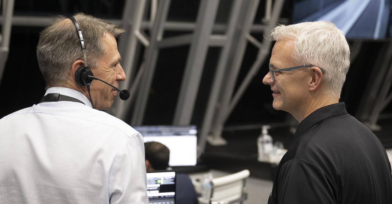 Zeb Scoville, NASA's chief flight director, left, and Benji Reed, senior director of Human Spaceflight Programs at SpaceX, right, are seen as teams monitor the countdown of the launch of a SpaceX Falcon 9 rocket carrying the company's Crew Dragon spacecraft on NASA’s SpaceX Crew-4 mission with NASA astronauts Kjell Lindgren, Robert Hines, Jessica Watkins, and ESA (European Space Agency) astronaut Samantha Cristoforetti onboard, Wednesday, April 27, 2022, in firing room four of the Rocco A. Petrone Launch Control Center at NASA’s Kennedy Space Center in Florida. NASA’s SpaceX Crew-4 mission is the fourth crew rotation mission of the SpaceX Crew Dragon spacecraft and Falcon 9 rocket to the International Space Station as part of the agency’s Commercial Crew Program. Lindgren, Hines, Watkins, and Cristoforetti launched at 3:52 a.m. ET, from Launch Complex 39A at the Kennedy Space Center. Photo Credit: (NASA/Joel Kowsky)