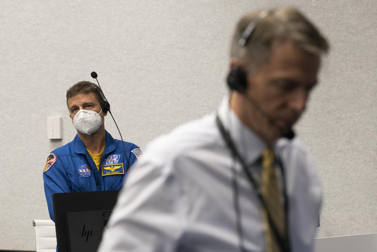 Reid Wiseman, Chief of the Astronaut Office, monitors the countdown of the launch of a SpaceX Falcon 9 rocket carrying the company's Crew Dragon spacecraft on NASA’s SpaceX Crew-4 mission with NASA astronauts Kjell Lindgren, Robert Hines, Jessica Watkins, and ESA (European Space Agency) astronaut Samantha Cristoforetti onboard, Wednesday, April 27, 2022, in firing room four of the Rocco A. Petrone Launch Control Center at NASA’s Kennedy Space Center in Florida. NASA’s SpaceX Crew-4 mission is the fourth crew rotation mission of the SpaceX Crew Dragon spacecraft and Falcon 9 rocket to the International Space Station as part of the agency’s Commercial Crew Program. Lindgren, Hines, Watkins, and Cristoforetti launched at 3:52 a.m. ET, from Launch Complex 39A at the Kennedy Space Center. Photo Credit: (NASA/Joel Kowsky)
