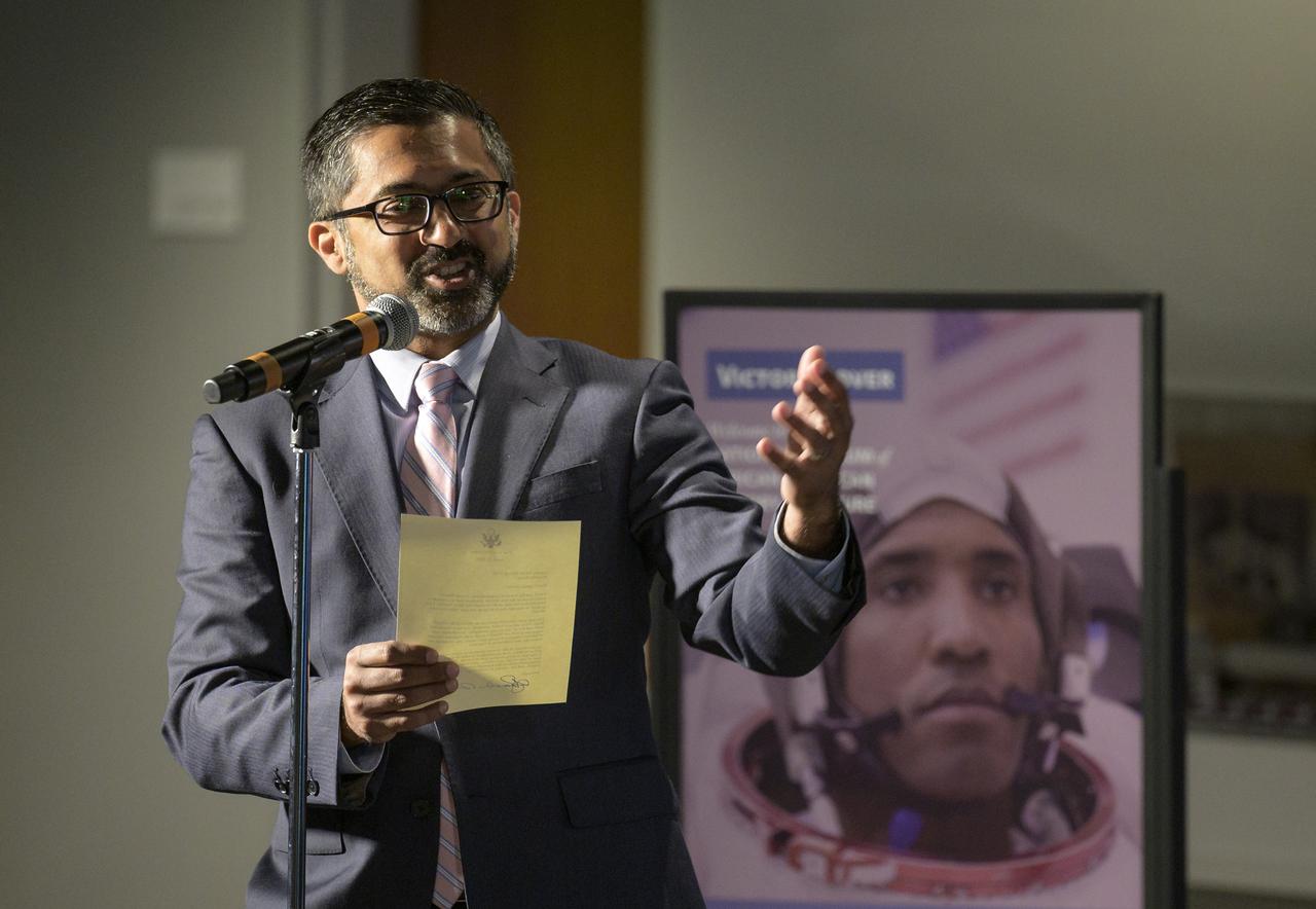 Chirag Parikh of the National Space Council reads a letter from Vice President Kamala Harris to NASA astronaut Victor Glover during an educational event, Thursday, April 28, 2022, at the National Museum of African American History and Culture in Washington. Glover most recently served as pilot and second-in-command on the Crew-1 SpaceX Crew Dragon, named Resilience, which landed after a long duration mission aboard the International Space Station, May 2, 2021. Photo Credit: (NASA/Bill Ingalls)