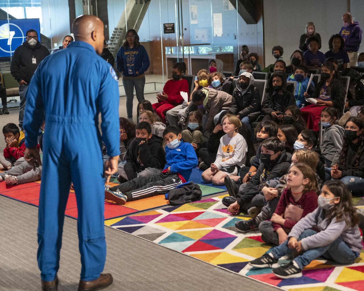 NASA astronaut Victor Glover talks with school students in person and via live stream during an educational event, Thursday, April 28, 2022, at the National Museum of African American History and Culture in Washington. Glover most recently served as pilot and second-in-command on the Crew-1 SpaceX Crew Dragon, named Resilience, which landed after a long duration mission aboard the International Space Station, May 2, 2021. Photo Credit: (NASA/Bill Ingalls)