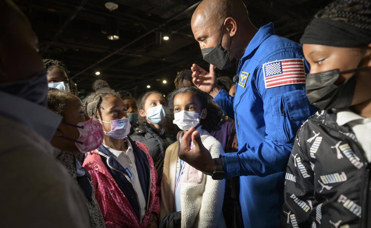 NASA astronaut Victor Glover talks with school students at the conclusion of an educational event, Thursday, April 28, 2022, at the National Museum of African American History and Culture in Washington. Glover most recently served as pilot and second-in-command on the Crew-1 SpaceX Crew Dragon, named Resilience, which landed after a long duration mission aboard the International Space Station, May 2, 2021. Photo Credit: (NASA/Bill Ingalls)