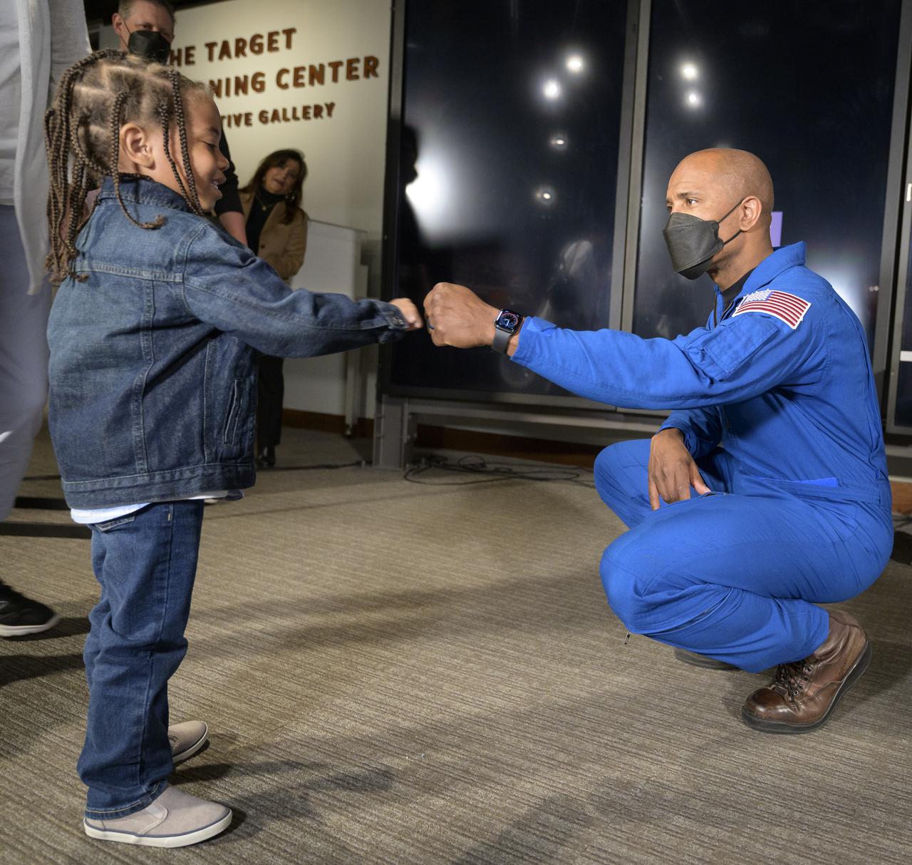 NASA astronaut Victor Glover fist pumps with 3-year-old Ezra Garrel at the conclusion of an educational event, Thursday, April 28, 2022, at the National Museum of African American History and Culture in Washington. Glover most recently served as pilot and second-in-command on the Crew-1 SpaceX Crew Dragon, named Resilience, which landed after a long duration mission aboard the International Space Station, May 2, 2021. Photo Credit: (NASA/Bill Ingalls)