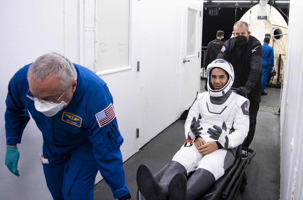 NASA astronaut Raja Chari greets friends after being helped out of the SpaceX Crew Dragon Endurance spacecraft onboard the SpaceX Shannon recovery ship after he and NASA astronauts Kayla Barron, Tom Marshburn, and ESA (European Space Agency) astronaut Matthias Maurer landed in the Gulf of Mexico off the coast of Tampa, Florida, Friday, May 6, 2022. Maurer, Marshburn, Chari, and Barron are returning after 177 days in space as part of Expeditions 66 and 67 onboard the International Space Station. Photo Credit: (NASA/Aubrey Gemignani)