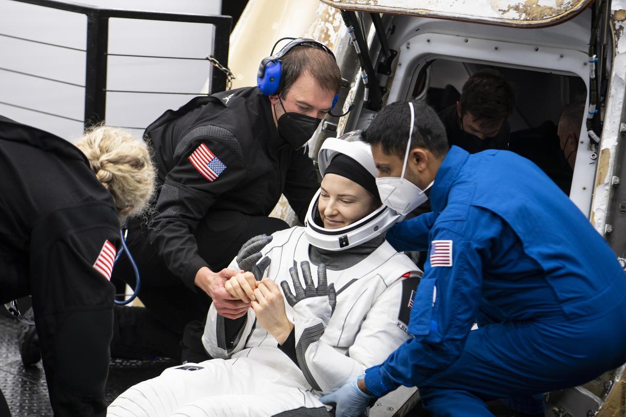 NASA astronaut Kayla Barron is helped out of the SpaceX Crew Dragon Endurance spacecraft onboard the SpaceX Shannon recovery ship after she and NASA astronauts Raja Chari, Tom Marshburn, and ESA (European Space Agency) astronaut Matthias Maurer landed in the Gulf of Mexico off the coast of Tampa, Florida, Friday, May 6, 2022. Maurer, Marshburn, Chari, and Barron are returning after 177 days in space as part of Expeditions 66 and 67 onboard the International Space Station. Photo Credit: (NASA/Aubrey Gemignani)