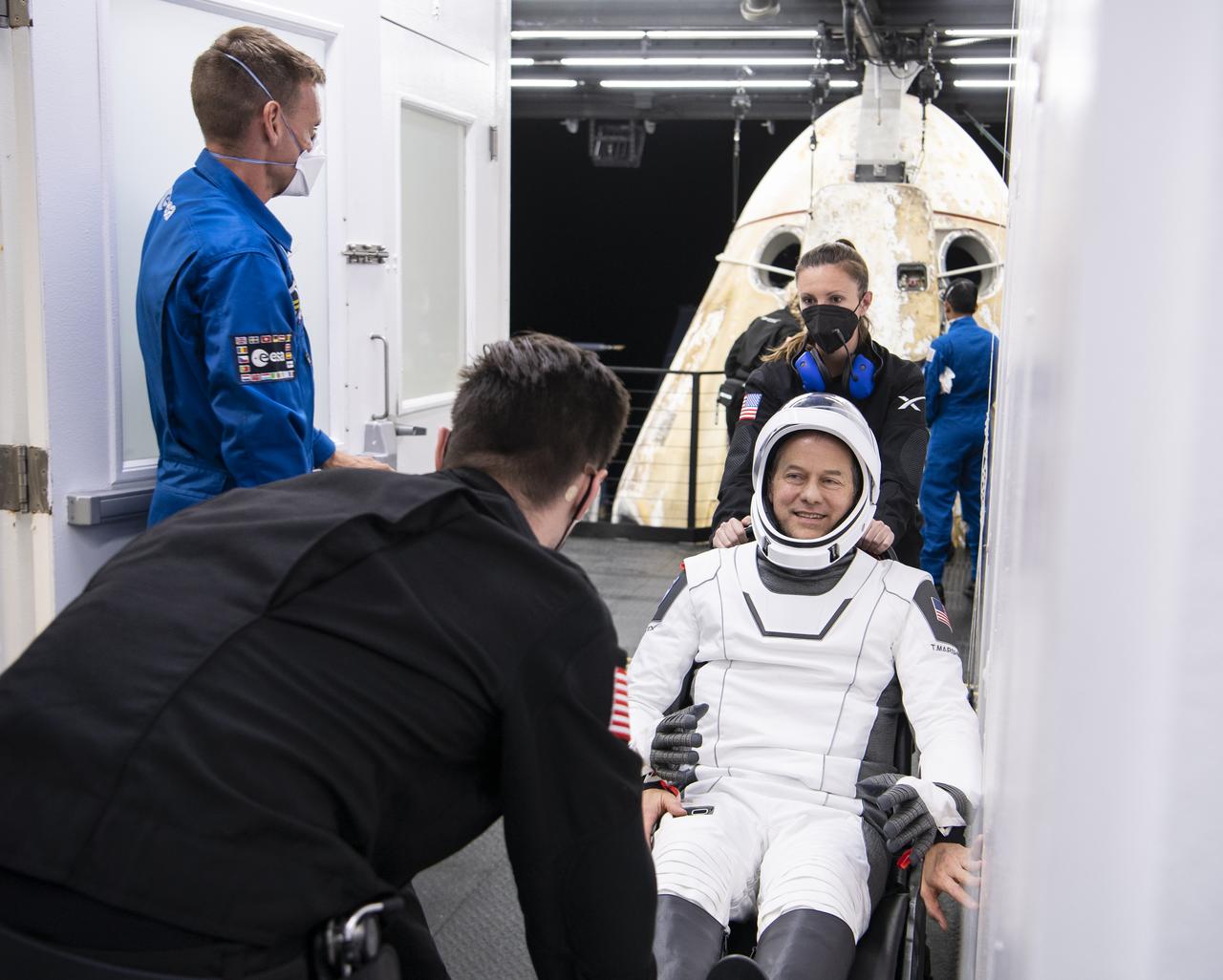 NASA astronaut Tom Marshburn greets friends after being helped out of the SpaceX Crew Dragon Endurance spacecraft onboard the SpaceX Shannon recovery ship after he and NASA astronauts Raja Chari, Kayla Barron, and ESA (European Space Agency) astronaut Matthias Maurer landed in the Gulf of Mexico off the coast of Tampa, Florida, Friday, May 6, 2022. Maurer, Marshburn, Chari, and Barron are returning after 177 days in space as part of Expeditions 66 and 67 onboard the International Space Station. Photo Credit: (NASA/Aubrey Gemignani)