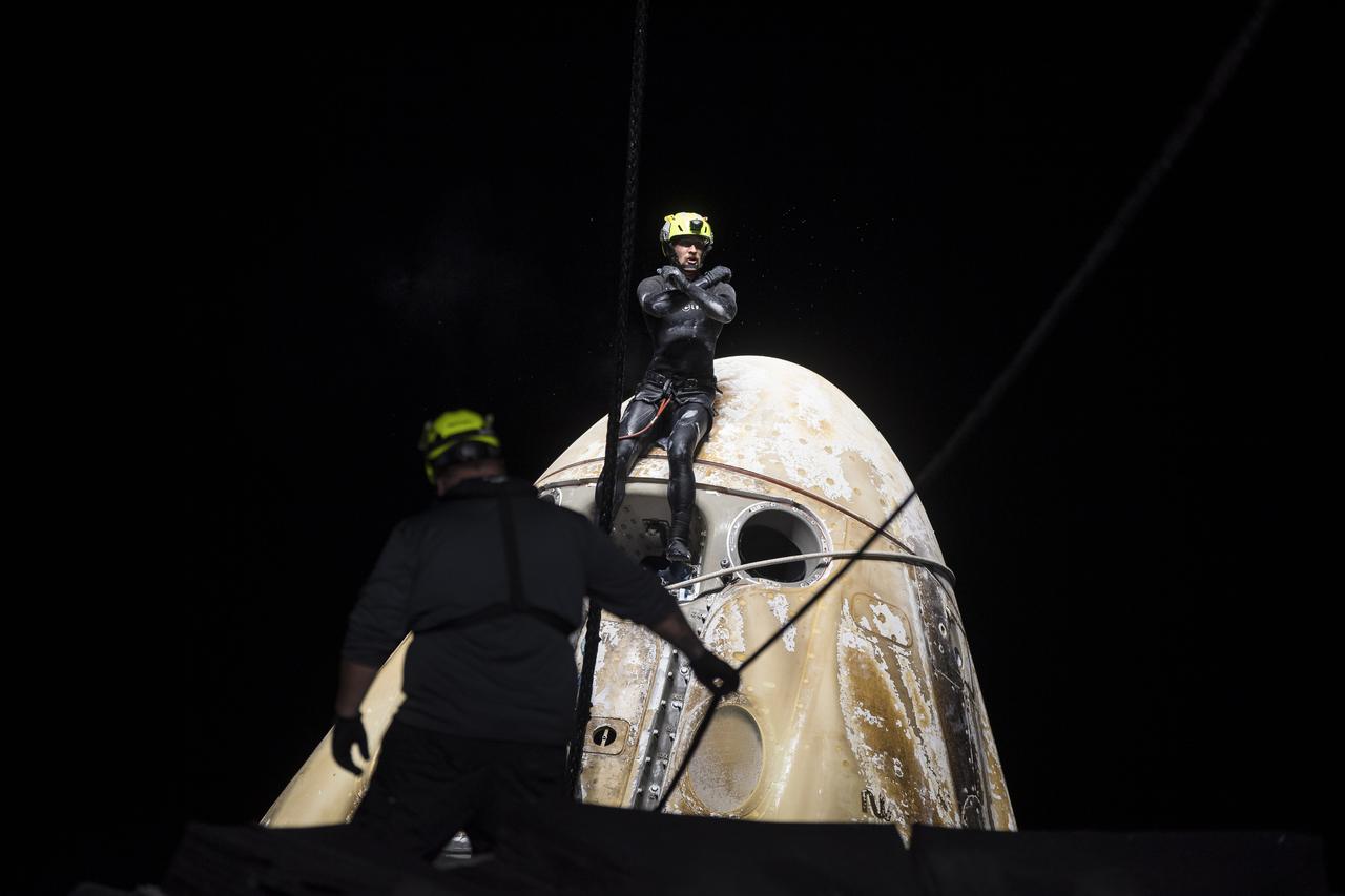 Support teams work around the SpaceX Crew Dragon Endurance spacecraft shortly after it landed with NASA astronauts Raja Chari, Kayla Barron, Tom Marshburn, and ESA (European Space Agency) astronaut Matthias Maurer aboard, in the Gulf of Mexico, off the coast of Tampa, Florida, Friday, May 6, 2022. Maurer, Marshburn, Chari, and Barron are returning after 177 days in space as part of Expeditions 66 and 67 aboard the International Space Station. Photo Credit: (NASA/Aubrey Gemignani)