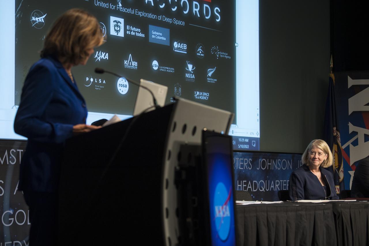 NASA Deputy Administrator Pam Melroy, right, is seen as Colombian Vice President and Foreign Minister, Marta Lucía Ramírez speaks before signing the Artemis Accords, Tuesday, May 10, 2022, at NASA Headquarters in Washington DC. Colombia is the nineteenth country to sign the Artemis Accords, which establish a practical set of principles to guide space exploration cooperation among nations participating in NASA’s Artemis program. Photo Credit: (NASA/Aubrey Gemignani)