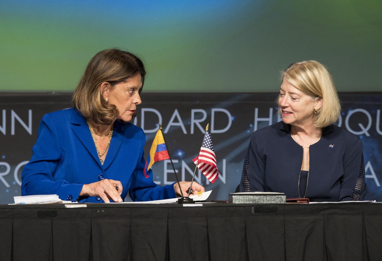 Colombian Vice President and Foreign Minister, Marta Lucía Ramírez, left, speaks to NASA Deputy Administrator Pam Melroy, before signing the Artemis Accords, Tuesday, May 10, 2022, at NASA Headquarters in Washington DC. Colombia is the nineteenth country to sign the Artemis Accords, which establish a practical set of principles to guide space exploration cooperation among nations participating in NASA’s Artemis program. Photo Credit: (NASA/Aubrey Gemignani)