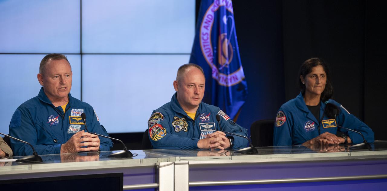 NASA astronauts Barry "Butch" Wilmore, left, Mike Fincke, center, and Suni Williams, right, are seen during a press conference ahead of the launch of Boeing’s Starliner spacecraft aboard a United Launch Alliance Atlas V rocket, Wednesday, May 18, 2022, at NASA’s Kennedy Space Center in Florida. Boeing’s Orbital Flight Test-2 will be Starliner’s second uncrewed flight test and will dock to the International Space Station as part of NASA's Commercial Crew Program. The mission, currently targeted for launch on 6:54 p.m. ET on May 19, will serve as an end-to-end test of the system's capabilities. Photo Credit: (NASA/Joel Kowsky)