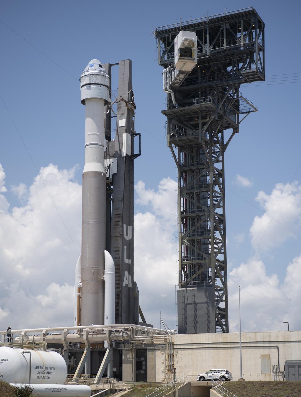 The crew access arm is seen as it swings into position for Boeing’s CST-100 Starliner spacecraft atop a United Launch Alliance Atlas V rocket at the launch pad at Space Launch Complex 41 ahead of the Orbital Flight Test-2 mission, Wednesday, May 18, 2022 at Cape Canaveral Space Force Station in Florida. Boeing’s Orbital Flight Test-2 will be Starliner’s second uncrewed flight test and will dock to the International Space Station as part of NASA's Commercial Crew Program. The mission, currently targeted for launch on 6:54 p.m. ET on May 19, will serve as an end-to-end test of the system's capabilities. Photo Credit: (NASA/Joel Kowsky)