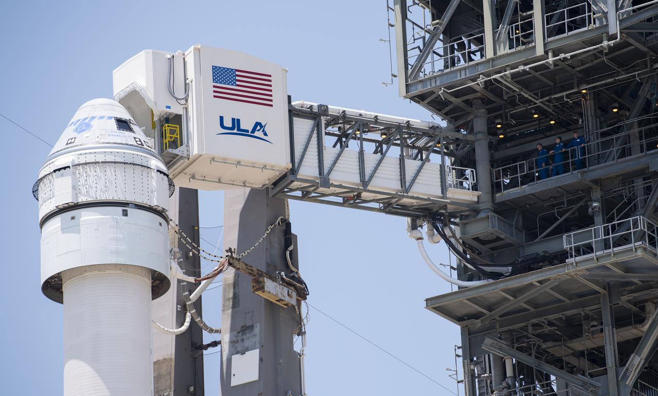 The crew access arm is seen as it swings into position for Boeing’s CST-100 Starliner spacecraft atop a United Launch Alliance Atlas V rocket at the launch pad at Space Launch Complex 41 ahead of the Orbital Flight Test-2 mission, Wednesday, May 18, 2022 at Cape Canaveral Space Force Station in Florida. Boeing’s Orbital Flight Test-2 will be Starliner’s second uncrewed flight test and will dock to the International Space Station as part of NASA's Commercial Crew Program. The mission, currently targeted for launch on 6:54 p.m. ET on May 19, will serve as an end-to-end test of the system's capabilities. Photo Credit: (NASA/Joel Kowsky)