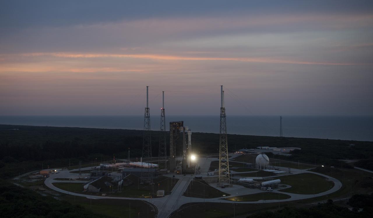 A United Launch Alliance Atlas V rocket with Boeing’s CST-100 Starliner spacecraft aboard is seen at sunset on the launch pad at Space Launch Complex 41 ahead of the Orbital Flight Test-2 mission, Wednesday, May 18, 2022 at Cape Canaveral Space Force Station in Florida. Boeing’s Orbital Flight Test-2 will be Starliner’s second uncrewed flight test and will dock to the International Space Station as part of NASA's Commercial Crew Program. The mission, currently targeted for launch on 6:54 p.m. ET on May 19, will serve as an end-to-end test of the system's capabilities. Photo Credit: (NASA/Joel Kowsky)