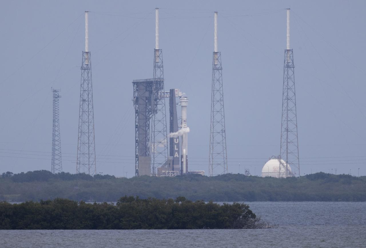 A United Launch Alliance Atlas V rocket with Boeing’s CST-100 Starliner spacecraft aboard is seen on the launch pad at Space Launch Complex 41 as the countdown progresses for the launch of the Orbital Flight Test-2 mission, Thursday, May 19, 2022 at Cape Canaveral Space Force Station in Florida. Boeing’s Orbital Flight Test-2 will be Starliner’s second uncrewed flight test and will dock to the International Space Station as part of NASA's Commercial Crew Program. The mission, currently targeted for launch at 6:54 p.m. ET, will serve as an end-to-end test of the system's capabilities. Photo Credit: (NASA/Joel Kowsky)