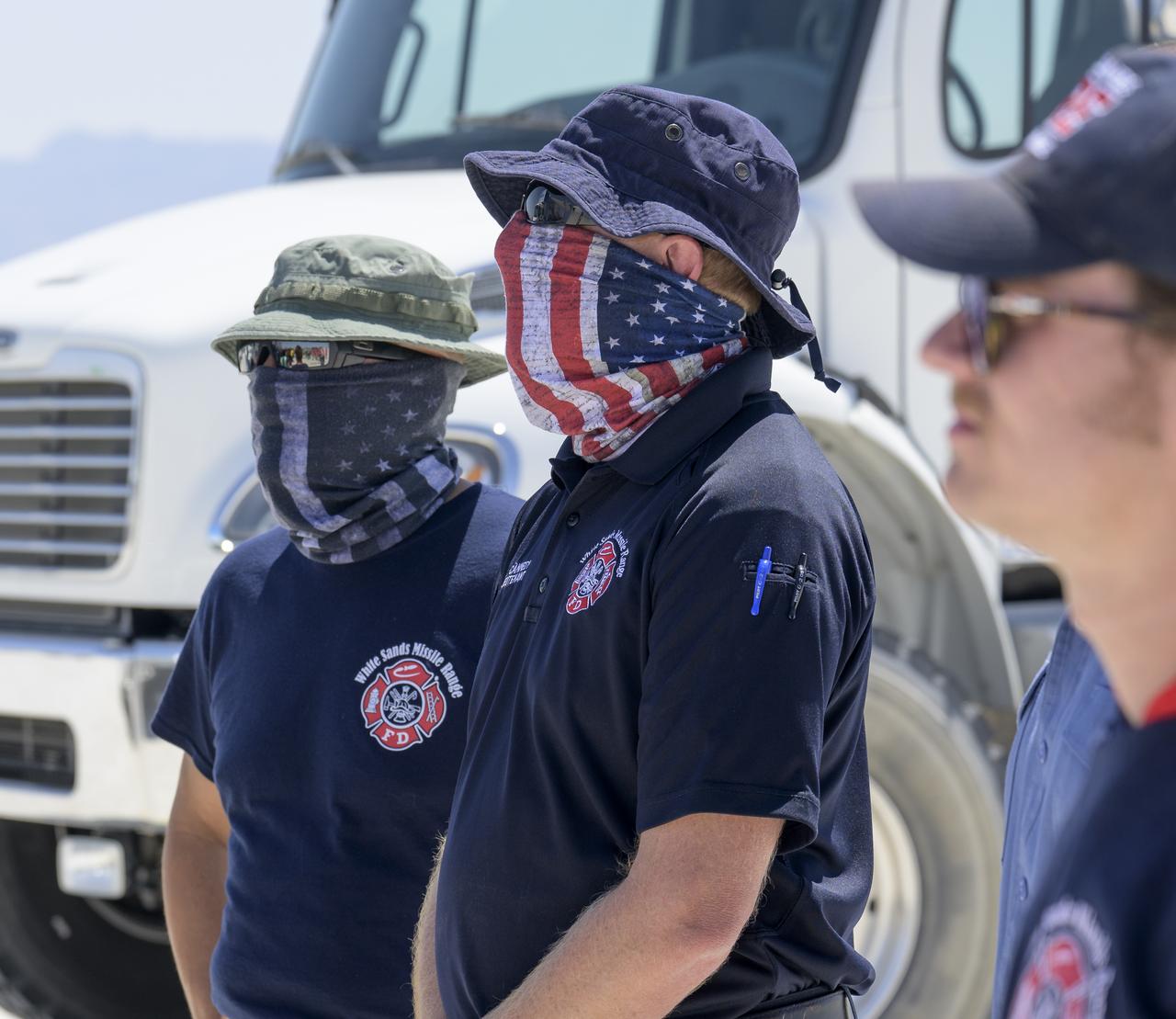 White Sands Missile Range Fire Department team members listen to a pretending briefing as they, NASA, and Boeing teams prepare for the landing of Boeing’s CST-100 Starliner spacecraft at White Sands Missile Range’s Space Harbor, Wednesday, May 25, 2022, in New Mexico. Boeing’s Orbital Flight Test-2 (OFT-2) is Starliner’s second uncrewed flight test to the International Space Station as part of NASA's Commercial Crew Program. OFT-2 serves as an end-to-end test of the system's capabilities. Photo Credit: (NASA/Bill Ingalls)