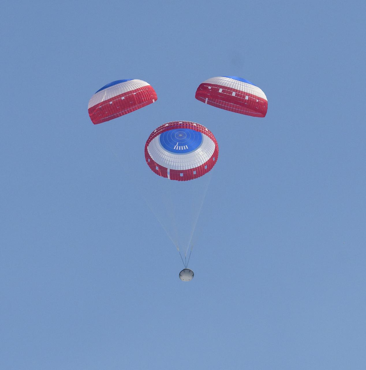 Boeing’s CST-100 Starliner spacecraft lands at White Sands Missile Range’s Space Harbor, Wednesday, May 25, 2022, in New Mexico. Boeing’s Orbital Flight Test-2 (OFT-2) is Starliner’s second uncrewed flight test to the International Space Station as part of NASA's Commercial Crew Program. OFT-2 serves as an end-to-end test of the system's capabilities. Photo Credit: (NASA/Bill Ingalls)