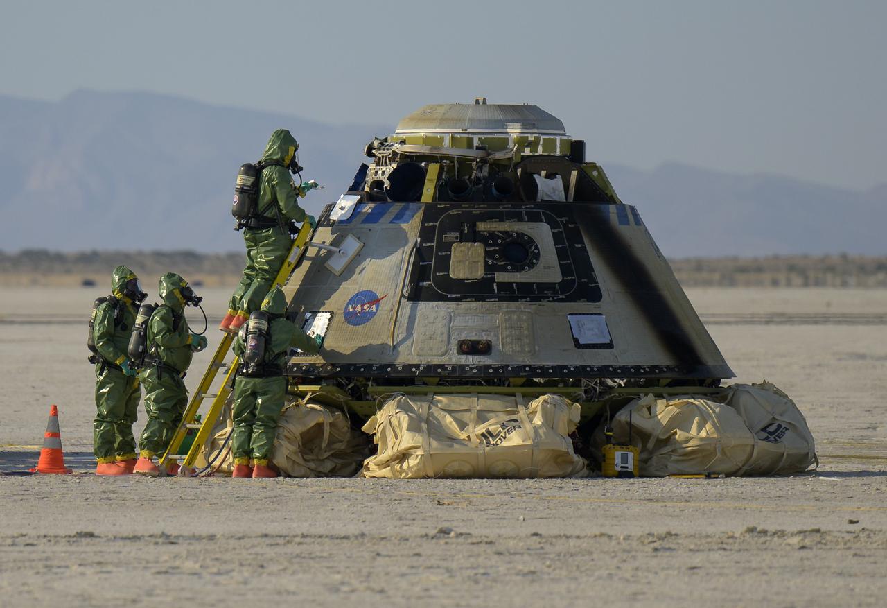 Boeing and NASA teams work around Boeing’s CST-100 Starliner spacecraft after it landed at White Sands Missile Range’s Space Harbor, Wednesday, May 25, 2022, in New Mexico. Boeing’s Orbital Flight Test-2 (OFT-2) is Starliner’s second uncrewed flight test to the International Space Station as part of NASA's Commercial Crew Program. OFT-2 serves as an end-to-end test of the system's capabilities. Photo Credit: (NASA/Bill Ingalls)