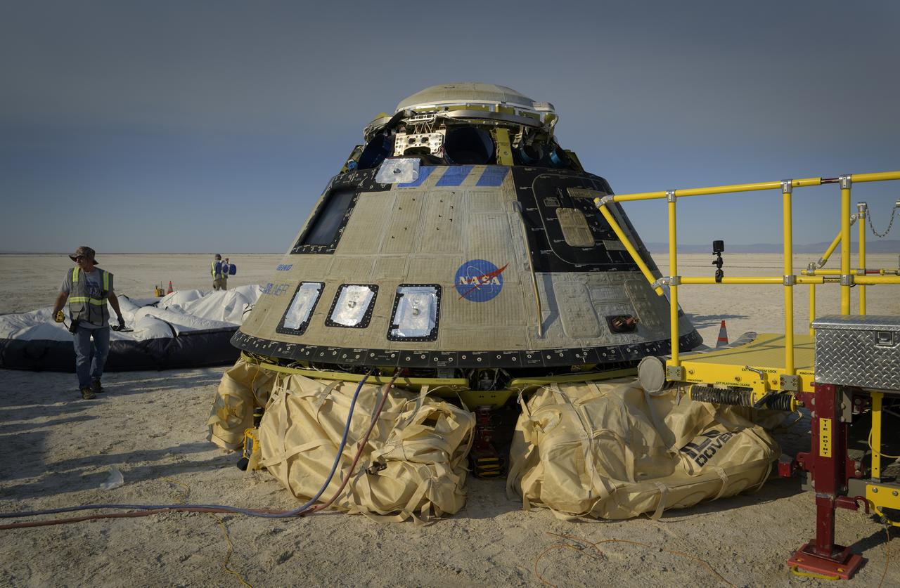 Boeing and NASA teams work around Boeing’s CST-100 Starliner spacecraft after it landed at White Sands Missile Range’s Space Harbor, Wednesday, May 25, 2022, in New Mexico. Boeing’s Orbital Flight Test-2 (OFT-2) is Starliner’s second uncrewed flight test to the International Space Station as part of NASA's Commercial Crew Program. OFT-2 serves as an end-to-end test of the system's capabilities. Photo Credit: (NASA/Bill Ingalls)