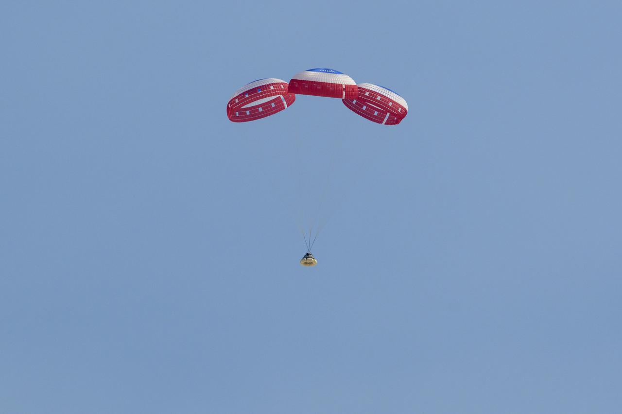 Boeing’s CST-100 Starliner spacecraft lands at White Sands Missile Range’s Space Harbor, Wednesday, May 25, 2022, in New Mexico. Boeing’s Orbital Flight Test-2 (OFT-2) is Starliner’s second uncrewed flight test to the International Space Station as part of NASA's Commercial Crew Program. OFT-2 serves as an end-to-end test of the system's capabilities. Photo Credit: (NASA/Bill Ingalls)