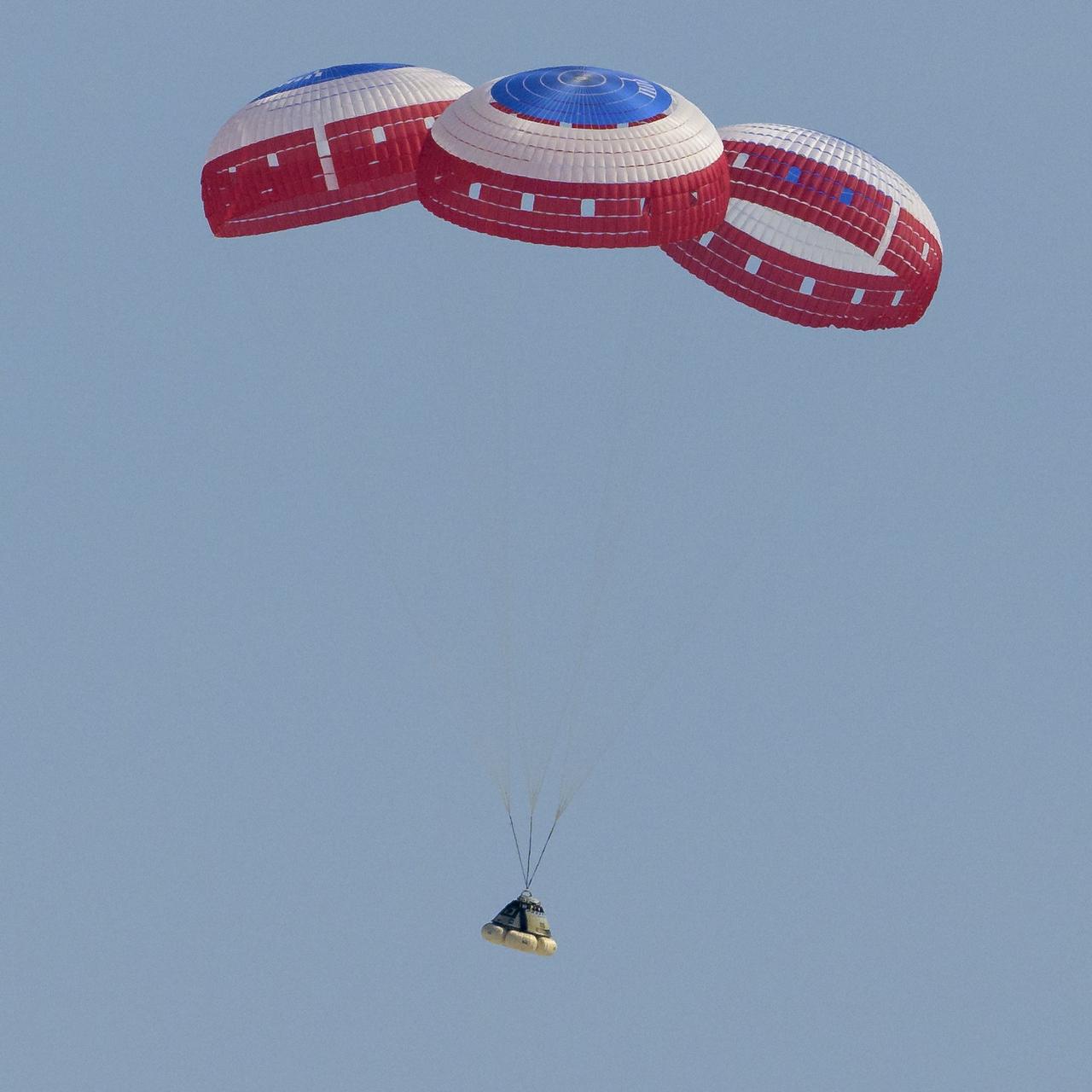 Boeing’s CST-100 Starliner spacecraft lands at White Sands Missile Range’s Space Harbor, Wednesday, May 25, 2022, in New Mexico. Boeing’s Orbital Flight Test-2 (OFT-2) is Starliner’s second uncrewed flight test to the International Space Station as part of NASA's Commercial Crew Program. OFT-2 serves as an end-to-end test of the system's capabilities. Photo Credit: (NASA/Bill Ingalls)