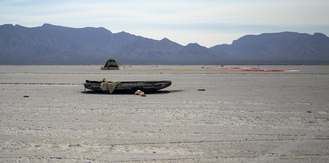Boeing’s CST-100 Starliner spacecraft, parachute and heat shield are seen after it landed at White Sands Missile Range’s Space Harbor, Wednesday, May 25, 2022, in New Mexico. Boeing’s Orbital Flight Test-2 (OFT-2) is Starliner’s second uncrewed flight test to the International Space Station as part of NASA's Commercial Crew Program. OFT-2 serves as an end-to-end test of the system's capabilities. Photo Credit: (NASA/Bill Ingalls)