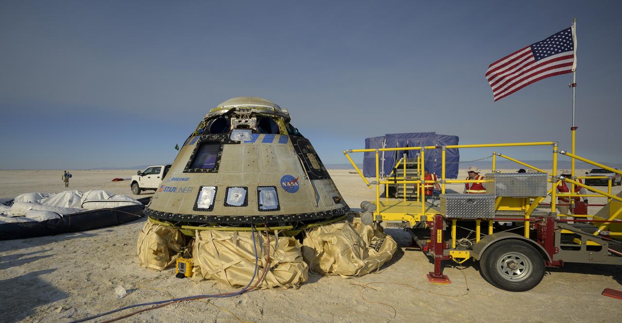 Boeing and NASA teams work around Boeing’s CST-100 Starliner spacecraft after it landed at White Sands Missile Range’s Space Harbor, Wednesday, May 25, 2022, in New Mexico. Boeing’s Orbital Flight Test-2 (OFT-2) is Starliner’s second uncrewed flight test to the International Space Station as part of NASA's Commercial Crew Program. OFT-2 serves as an end-to-end test of the system's capabilities. Photo Credit: (NASA/Bill Ingalls)