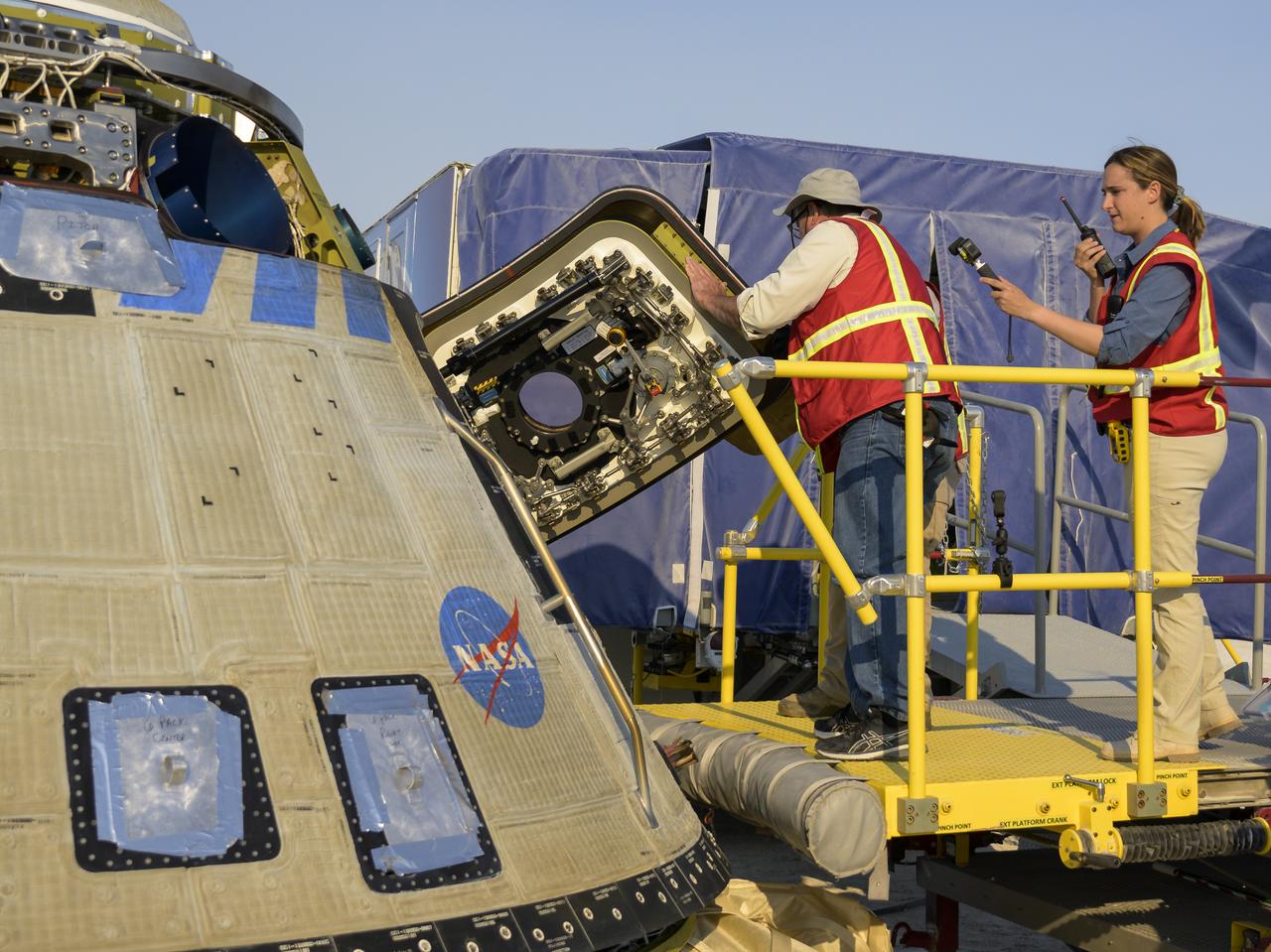 Boeing and NASA teams work around Boeing’s CST-100 Starliner spacecraft after it landed at White Sands Missile Range’s Space Harbor, Wednesday, May 25, 2022, in New Mexico. Boeing’s Orbital Flight Test-2 (OFT-2) is Starliner’s second uncrewed flight test to the International Space Station as part of NASA's Commercial Crew Program. OFT-2 serves as an end-to-end test of the system's capabilities. Photo Credit: (NASA/Bill Ingalls)