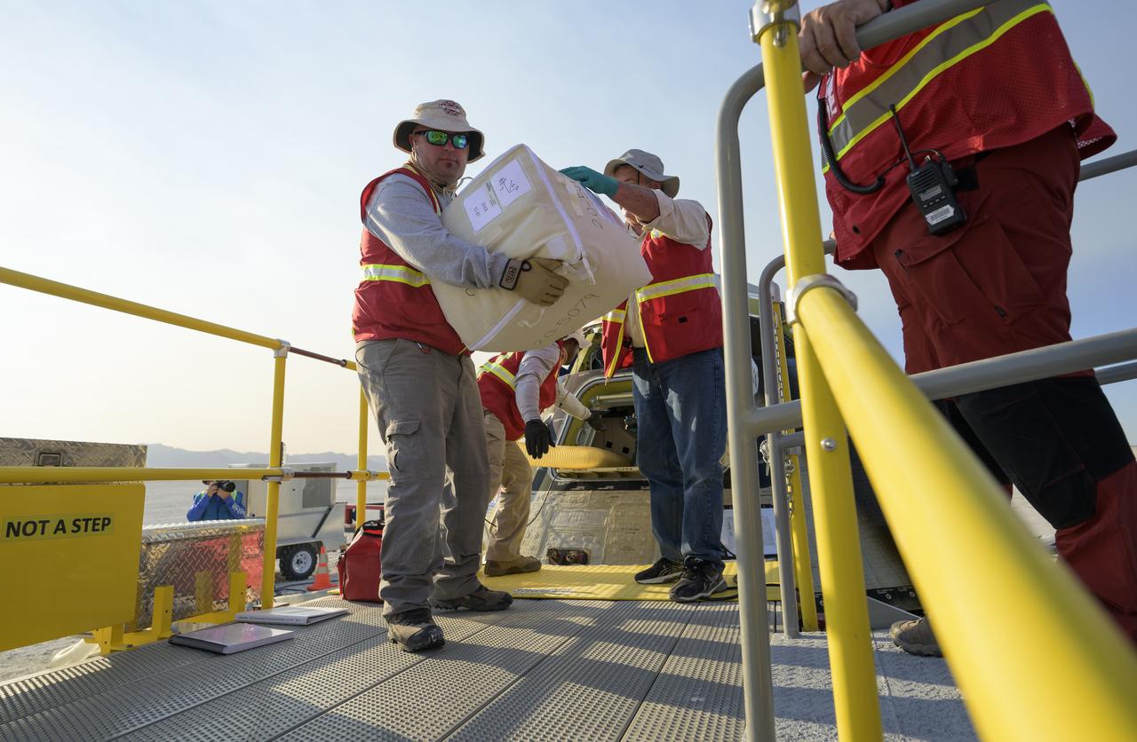 Boeing and NASA teams unload cargo from Boeing’s CST-100 Starliner spacecraft after it landed at White Sands Missile Range’s Space Harbor, Wednesday, May 25, 2022, in New Mexico. Boeing’s Orbital Flight Test-2 (OFT-2) is Starliner’s second uncrewed flight test to the International Space Station as part of NASA's Commercial Crew Program. OFT-2 serves as an end-to-end test of the system's capabilities. Photo Credit: (NASA/Bill Ingalls)