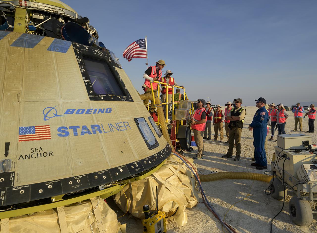 Boeing and NASA teams work around Boeing’s CST-100 Starliner spacecraft after it landed at White Sands Missile Range’s Space Harbor, Wednesday, May 25, 2022, in New Mexico. Boeing’s Orbital Flight Test-2 (OFT-2) is Starliner’s second uncrewed flight test to the International Space Station as part of NASA's Commercial Crew Program. OFT-2 serves as an end-to-end test of the system's capabilities. Photo Credit: (NASA/Bill Ingalls)