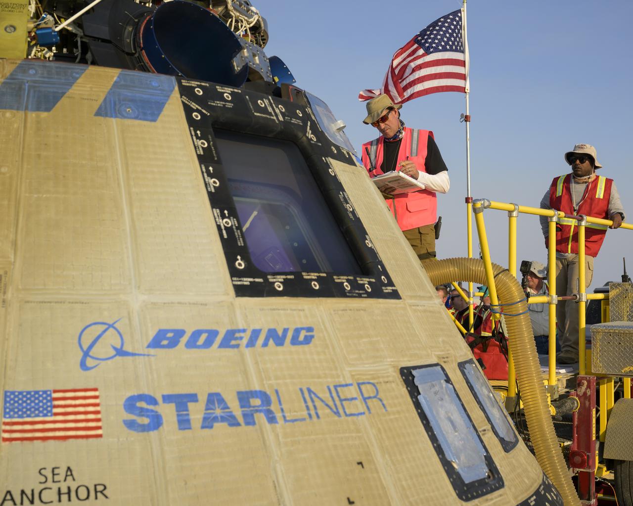 Boeing and NASA teams work around Boeing’s CST-100 Starliner spacecraft after it landed at White Sands Missile Range’s Space Harbor, Wednesday, May 25, 2022, in New Mexico. Boeing’s Orbital Flight Test-2 (OFT-2) is Starliner’s second uncrewed flight test to the International Space Station as part of NASA's Commercial Crew Program. OFT-2 serves as an end-to-end test of the system's capabilities. Photo Credit: (NASA/Bill Ingalls)