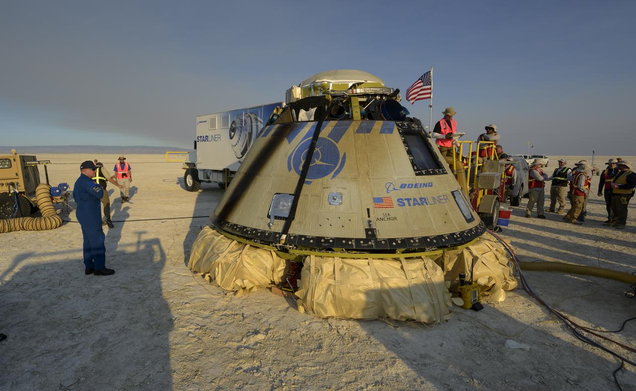Boeing and NASA teams work around Boeing’s CST-100 Starliner spacecraft after it landed at White Sands Missile Range’s Space Harbor, Wednesday, May 25, 2022, in New Mexico. Boeing’s Orbital Flight Test-2 (OFT-2) is Starliner’s second uncrewed flight test to the International Space Station as part of NASA's Commercial Crew Program. OFT-2 serves as an end-to-end test of the system's capabilities. Photo Credit: (NASA/Bill Ingalls)