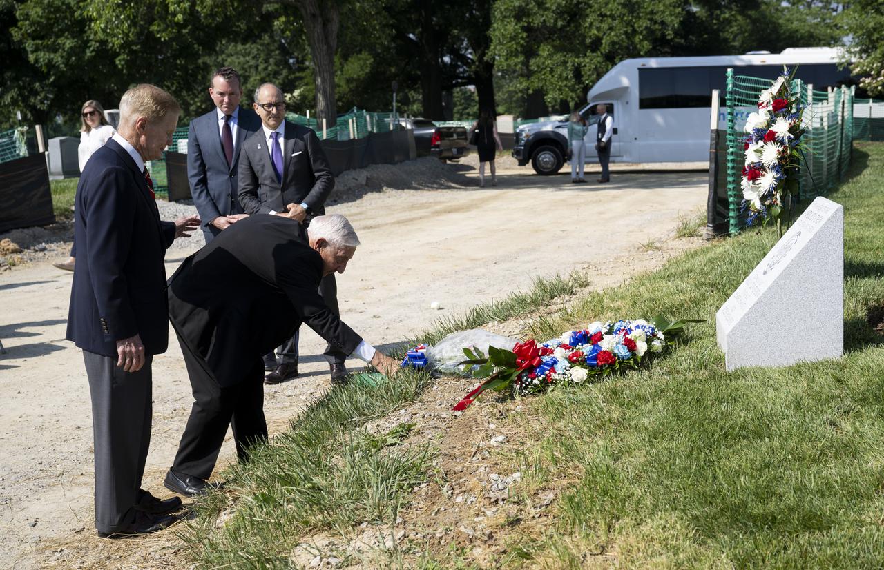 Lowell Grissom, brother of Apollo 1 astronaut Virgil I. “Gus” Grissom, is joined by NASA Administrator Bill Nelson as he places flowers at the Apollo 1 monument during its dedication at Arlington National Cemetery, Thursday, June 2, 2022, in Arlington, Va. The monument honors and memorializes the Apollo 1 crew of Virgil I. “Gus” Grissom, Edward H. White II, and Roger B. Chaffee. Photo Credit: (NASA/Bill Ingalls)