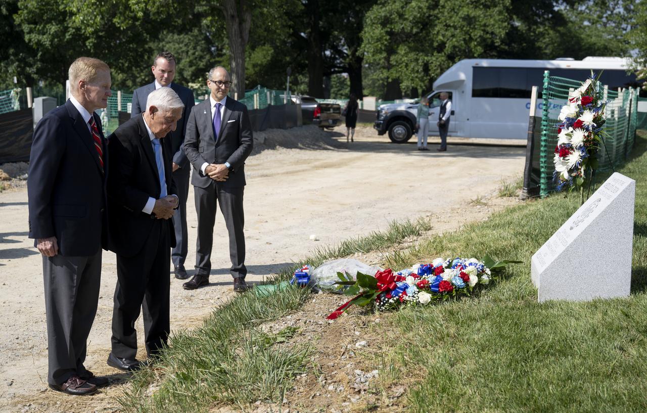 Lowell Grissom, brother of Apollo 1 astronaut Virgil I. “Gus” Grissom, is joined by NASA Administrator Bill Nelson as he places flowers at the Apollo 1 monument during its dedication at Arlington National Cemetery, Thursday, June 2, 2022, in Arlington, Va.  Photo Credit: (NASA/Bill Ingalls)