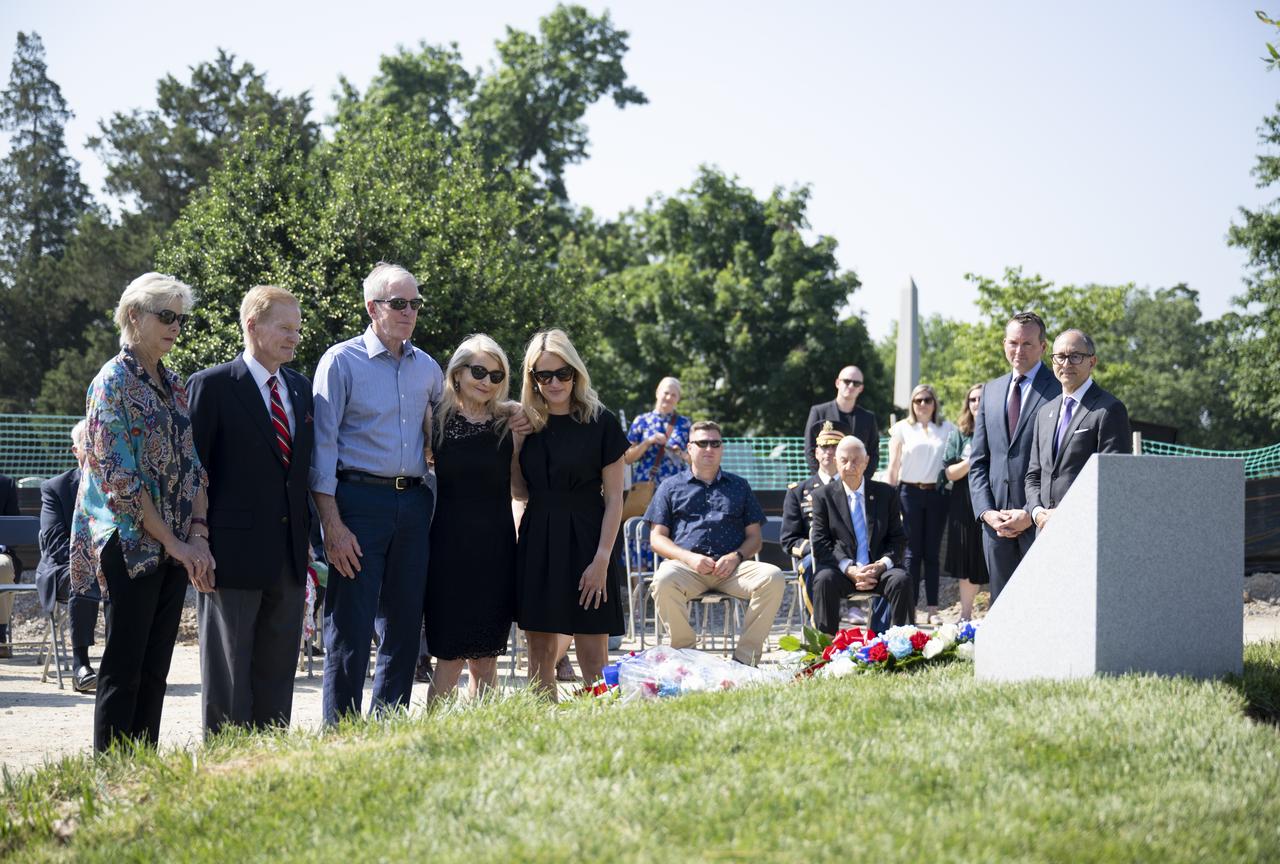 Family members of Apollo 1 astronaut Edward H. White II are joined by NASA Administrator Bill Nelson as they place flowers at the Apollo 1 monument during its dedication at Arlington National Cemetery, Thursday, June 2, 2022, in Arlington, Va. The monument honors and memorializes the Apollo 1 crew of Virgil I. “Gus” Grissom, Edward H. White II, and Roger B. Chaffee.  Photo Credit: (NASA/Bill Ingalls)