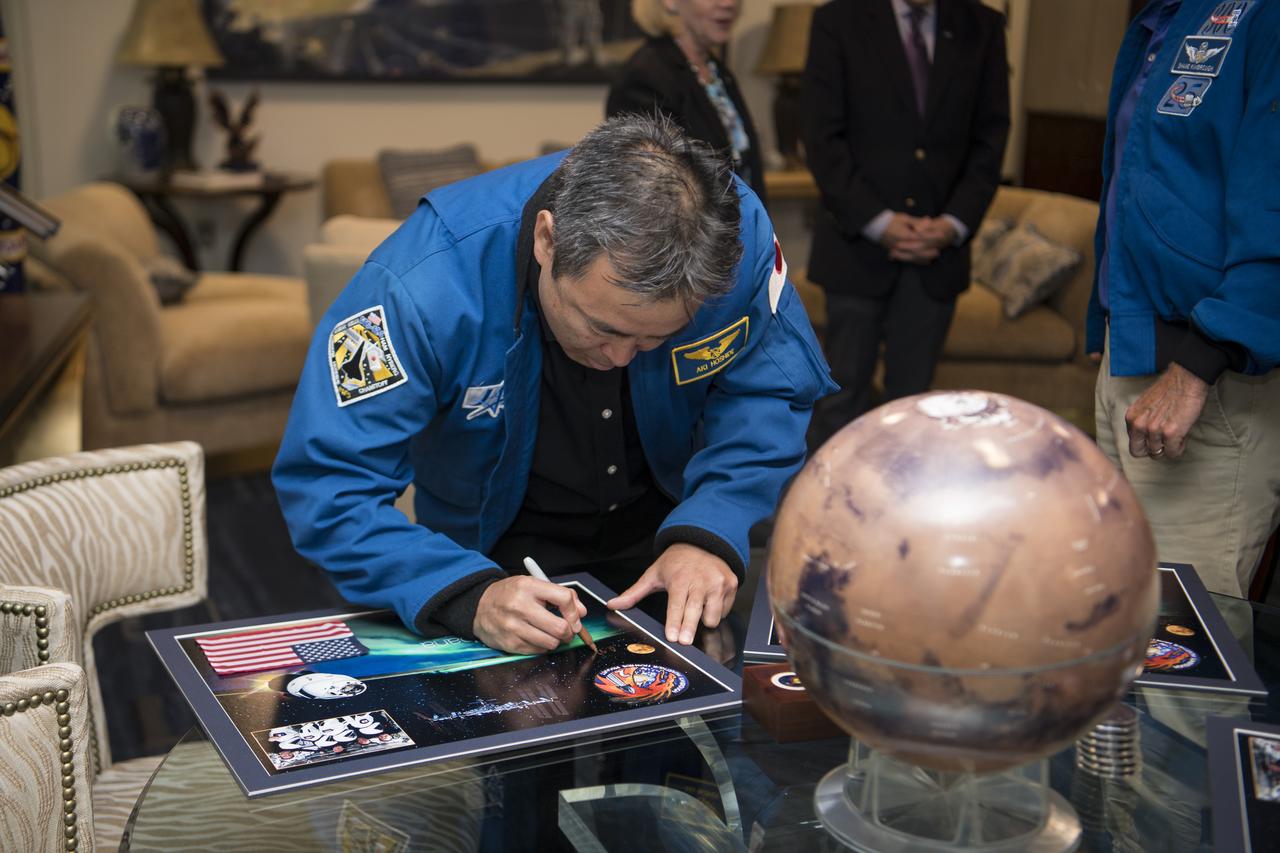 NASA’s SpaceX Crew-2 Japan Aerospace Exploration Agency (JAXA) astronaut Akihiko Hoshide, signs a montage for NASA Associate Administrator Bob Cabana, Monday, June 6, 2022, at the Mary W. Jackson NASA Headquarters Building in Washington DC. Photo Credit: (NASA/Aubrey Gemignani)
