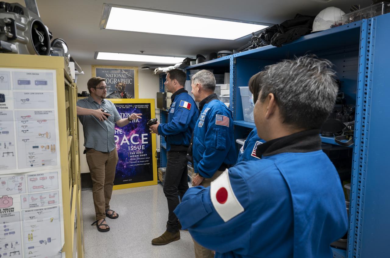 Photo Engineer Tom O’Brien speaks with NASA’s SpaceX Crew-2 astronauts during a tour of the Photo Engineering Department, Tuesday, June 7, 2022, at National Geographic Headquarters in Washington. Kimbrough, McArthur, Hoshide, and Pesquet completed the second crew rotation mission to the International Space Station as part of the agency’s Commercial Crew Program and spent 198 days aboard the orbiting laboratory as part of Expeditions 65 and 66. Photo Credit: (NASA/Keegan Barber)