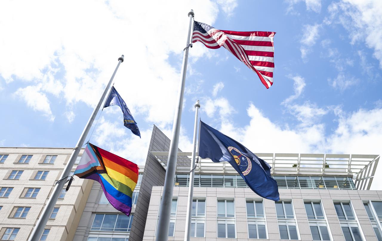 The Progress Pride flag is seen flying at the Mary W. Jackson NASA Headquarters Building, Thursday, June 9, 2022, in Washington, DC. In recognition of LGBTQ+ Pride Month, the Progress Pride flag will be flown outside of the agency’s headquarters for the month of June. Photo Credit: (NASA/Joel Kowsky)