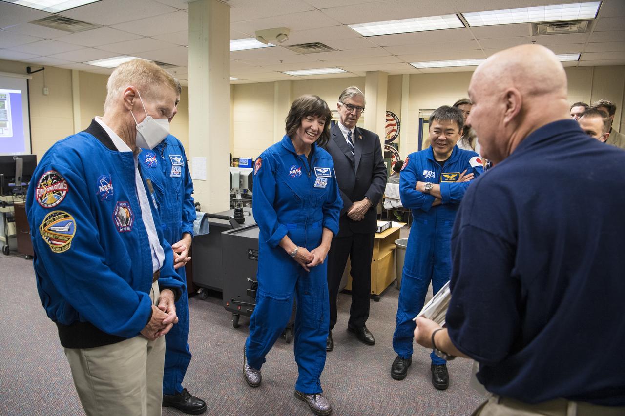 Arlington Science Focus Elementary School teacher, Charles Harvey, right, speaks to NASA Administrator Bill Nelson, left, and NASA’s SpaceX Crew-2 NASA astronauts Megan McArthur and Shane Kimbrough, and Japan Aerospace Exploration Agency (JAXA) astronaut Akihiko Hoshide, and U.S. Rep. Don Beyer, D-Va., in the Space Shuttle Simulator room, during a visit to Arlington Science Focus Elementary School, Friday, June 10, 2022, in Arlington, Virginia. Photo Credit: (NASA/Aubrey Gemignani)